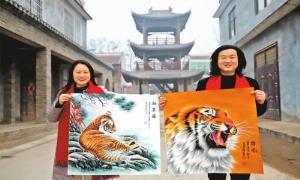 “画虎村”内画虎忙