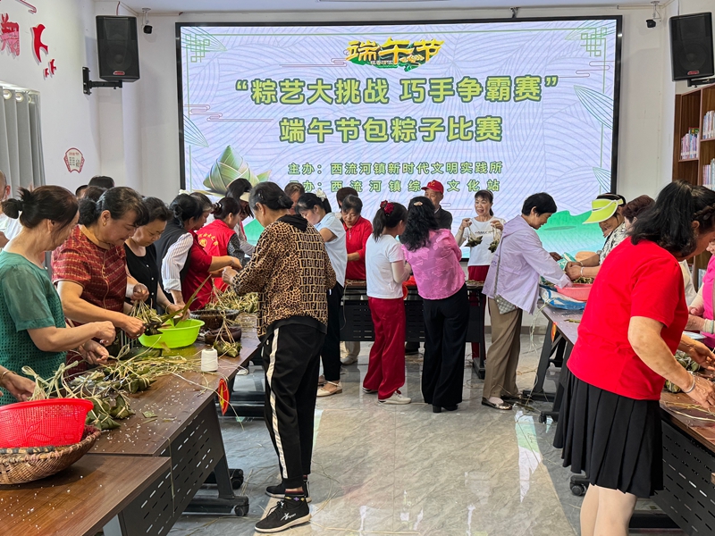 2025年5月30日,仙桃市西流河镇新时代文明实践所举行端午节“粽艺大挑战 巧手争霸赛”.jpg 2025年5月30日,仙桃市西流河镇新时代文明实践所举行端午节“粽艺大挑战 巧手争霸赛”.jpg